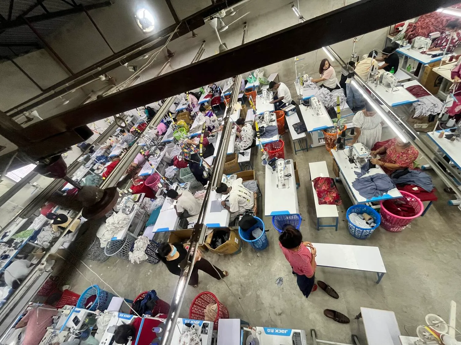 Overhead view of the Trishakti Apparel sewing floor in Gaindakot, Nepal, with rows of machines and operators