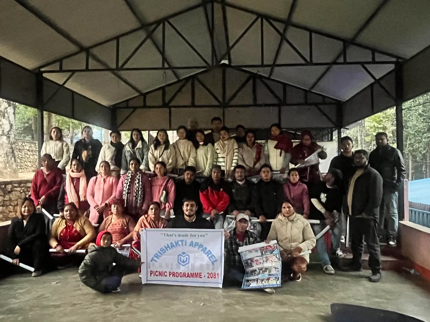 Group photograph of the Trishakti Apparel team at the 2081 company picnic