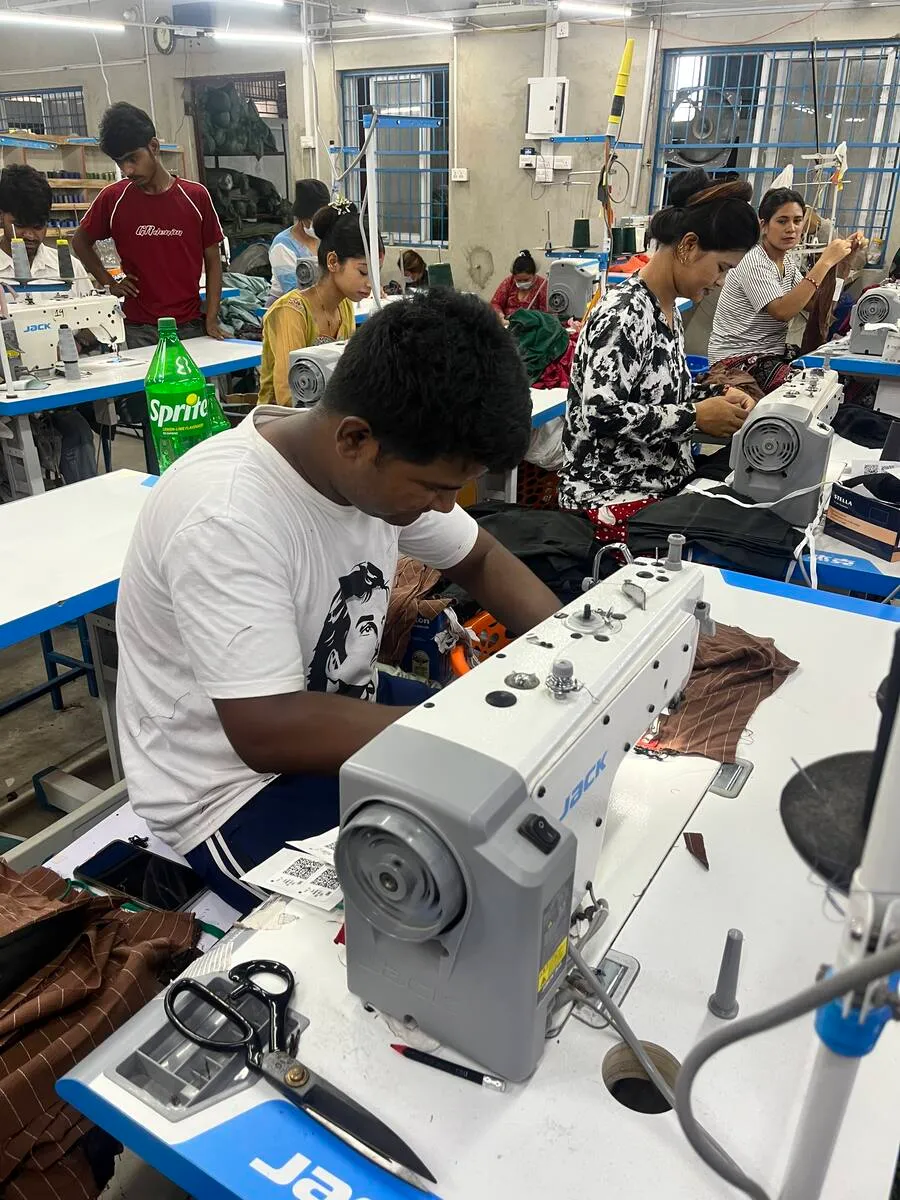An operator at work on the knit line in Gaindakot