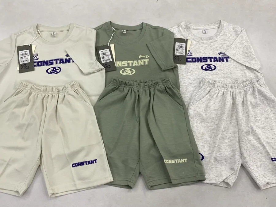Kids’ co-ord knit t-shirt and shorts sets laid flat with hangtags