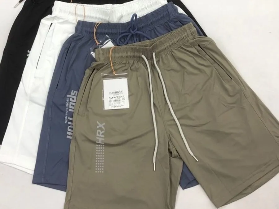 Private-label knit sport shorts in several colours laid flat with drawcords